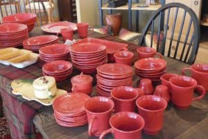 Red dishes on a table real life retirement