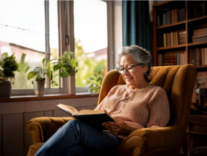 retired woman reading a book in her livingroom Real Life Retirement